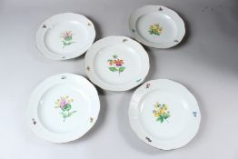 FIVE HEREND PORCELAIN BOWLS, with basketweave border, painted to the centre with a single flower.