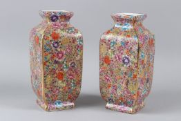 A PAIR OF PORCELAIN MILLEFIORI STYLE VASES. 25cms high.