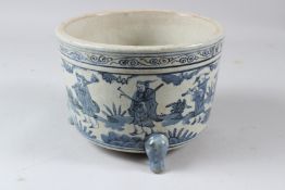 A CHINESE BLUE AND WHITE PORCELAIN JARDINIERE, painted with a band of figures carrying out various