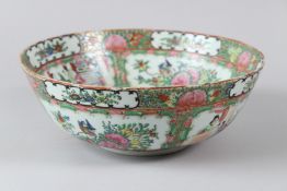 A CHINSE CANTON FAMILLE ROSE BOWL, 20TH CENTURY, painted with panels of flowers and figures. 26cms