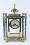 A DECORATIVE CLOISONNE AND GILT BRASS MANTLE CLOCK, with painted dial. 46cms high x 32cms wide.