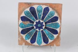 A FINE LARGE 18TH-19TH CENTURY NORTH INDIAN MULTAN GLAZED POTTERY TILE. 30cms long.