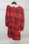 A RED AND BLUE TARTAN DRESS, with white lace collar and cuffs.