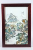 AN EARLY 20TH CENTURY CHINESE PORCELAIN FAMILLE VERTE PORCELAIN PANEL, framed, painted with a