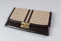 PIERRE BALMAIN, A BROWN LEATHER AND CLOTH CLUTCH BAG / ORGANISER.