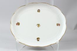 A HEREND PORCELAIN OVAL DISH, with basketweave border, painted with fungi. 31.5cms wide.