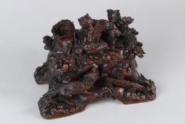 A LATE 19TH CENTURY BLACK FOREST CARVED WOOD BOX AND COVER, carved with two foxes and a game bird.