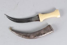 A FINE 19TH CENTURY PERSIAN QAJAR WALRUS HILTED WATERED STEEL DAGGER with silver scabbard. 31cms