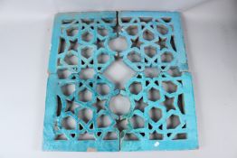 A 19TH CENTURY ISLAMIC, POSSIBLY INDIAN, OPEN WORKED TILE PANEL depicting geometric designs. Each