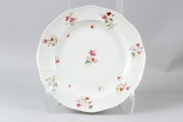 A HEREND PORCELAIN CIRCULAR DISH, with basketweave border, painted with flowers. 29.5cms diameter.