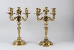 A GOOD PAIR OF ORMOLU FOUR BRANCH, FIVE LIGHT CANDELABRA, of classical form, with urns and swags, on