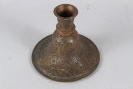A FINELY ENGRAVED 18TH-19TH CENTURY INDIAN BRASS HUQQA BASE with calligraphic decoration. 16cms