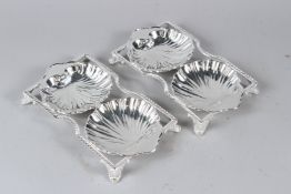 A PAIR OF PLATED DOUBLE SHELL SHAPED DISHES. 25cms wide.