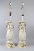 A PAIR OF ROYAL DUX PORCELAIN TABLE LAMPS modelled as Art Nouveau twin handled vases. 92cms high