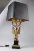 A LARGE FRENCH EMPIRE STYLE ORMOLU TABLE LAMP, modelled as an eagle seated on a rock, it's wings