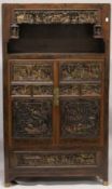A VERY GOOD CHINESE LACQUERED CABINET inset with numerous carved panels of very high quality. The