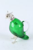 A SMALL GREEN GLAZED PARROT CLARET JUG WITH PLATED MOUNTS. 16cms high.