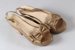 PRADA, A PAIR OF LADIES GILT LEATHER SHOES, with chunky cork heels, size 39.