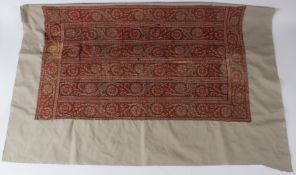 A PERSIAN / INDIAN ZAND TEXTILE FRAGMENT, with bands of stylised leaves and flowers, on a later