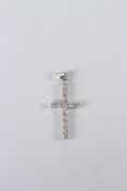 A DIAMOND CROSS in a white gold setting.