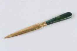 A JADE AND SILVER GILT LETTER OPENER.