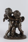 PIGALLE. a late 19th Century bronze group of two playful cherubs, signed to the base. 42cms high.