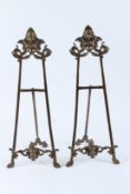 A PAIR OF ORNATE BRASS EASELS. 55cms high.