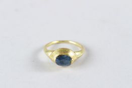A 22-24CT EARLY GOLD RING with large sapphire.