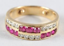 AN 18CT GOLD RUBY AND DIAMOND BAND RING.