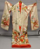 A HIGHLY DECORATIVE JAPANESE KIMONO, 20TH CENTURY, with all over floral decoration.