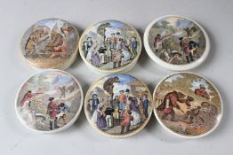SIX PRATTWARE POT LIDS, each decorated with various scenes of bear hunting and related topics. 7.