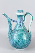A LARGE CHINESE PORCELAIN EWER, turquoise glazed stylised decoration. 34cms high.