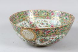 A 19TH CENTURY CHINESE CANTON PORCELAIN BOWL, for the Islamic market, repairs. 23cms diameter.