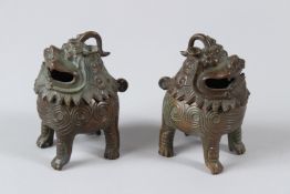 A PAIR OF ORIENTAL BRONZE INCENSE BURNERS. 10cms high.