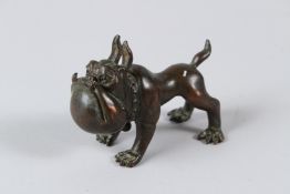 A JAPANESE BRONZE ARTICULATED DOG. 8cms.