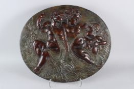 A GOOD LATE 19TH CENTURY RELIEF CAST OVAL BRONZE PLAQUE, depicting three Bacchanalian cherubs. 67cms