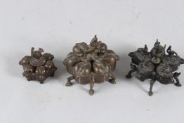 THREE 19TH CENTURY INDIAN BRASS SPICE BOXES. Largest 11cms diameter.