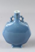 A SMALL CHINESE POWDER BLUE GLAZED MOON FLASK, of octagonal form. 18cms high.