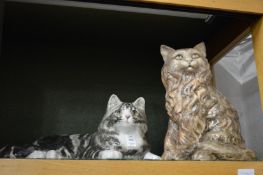 Two Winstanley cats and two other pottery cats.