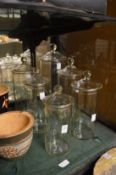 Six glass storage jars.