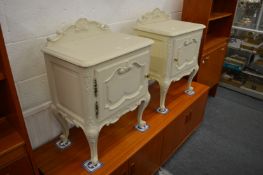A pair of French style painted bedside cupboards.