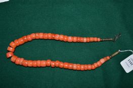 A coral necklace.