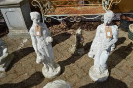 A pair of painted reconstituted stone garden ornaments as classical maidens.