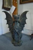 A large patinated cast iron model of a dragon.