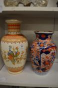 A Chinese vase and a Japanese Imari vase.