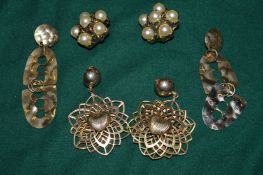 Three pairs of vintage style earrings.