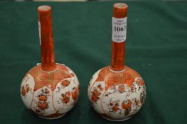 A pair of small Kutani bottle vases.