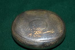An oval silver tobacco box.