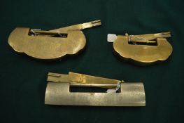 Three Chinese brass padlocks.