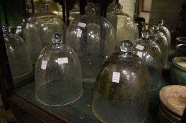Four glass bell cloches.